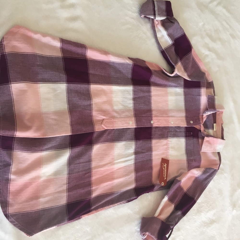 A pink and purple plaid dress with a gold belt